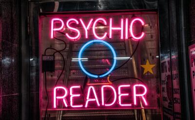 A neon sign of Psychic Reader.
