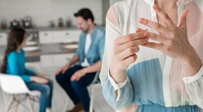 Close-up woman taking wedding ring off