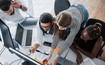 A group of multinational busy people working in the office.