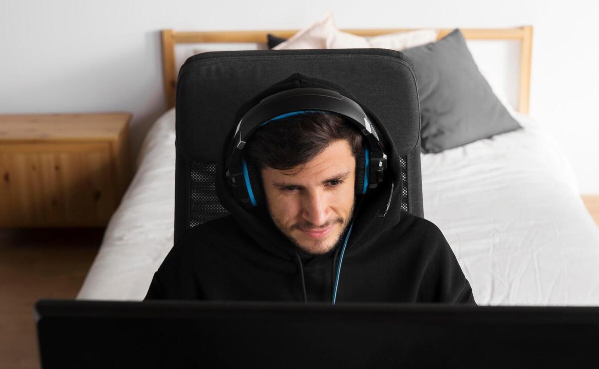 Man playing game on computer medium shot