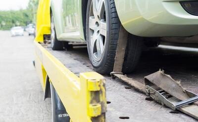 car transporter breakdown lorry during working using locked belt transport other green car