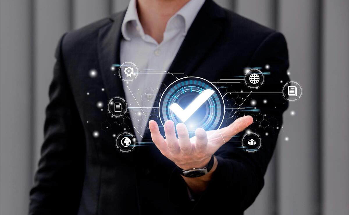 Man in dark blue suit keeping in hand digital ball.