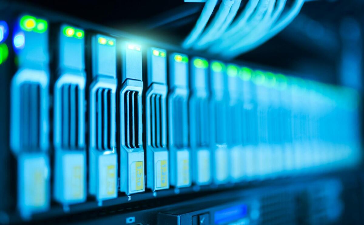 Detailed image of a server rack with glowing lights in a modern data center.