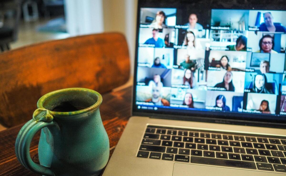 macbook pro displaying group of people