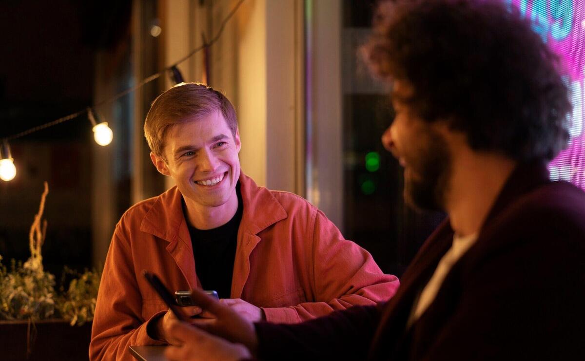 Friends sitting at a table and talking during a night out