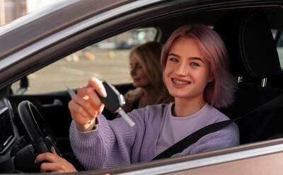 Woman taking her driver's license test in vehicle