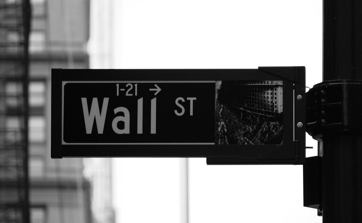 grayscale photo of Wall St. signage