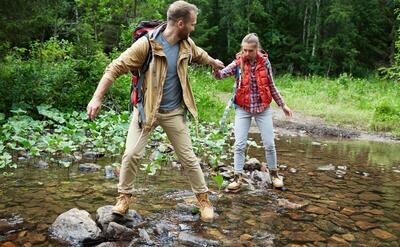 Hikers passing river