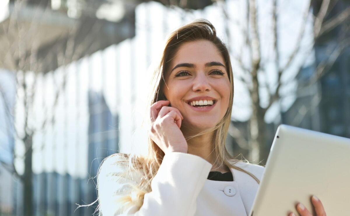 Woman In White Blazer Holding Tablet Computer