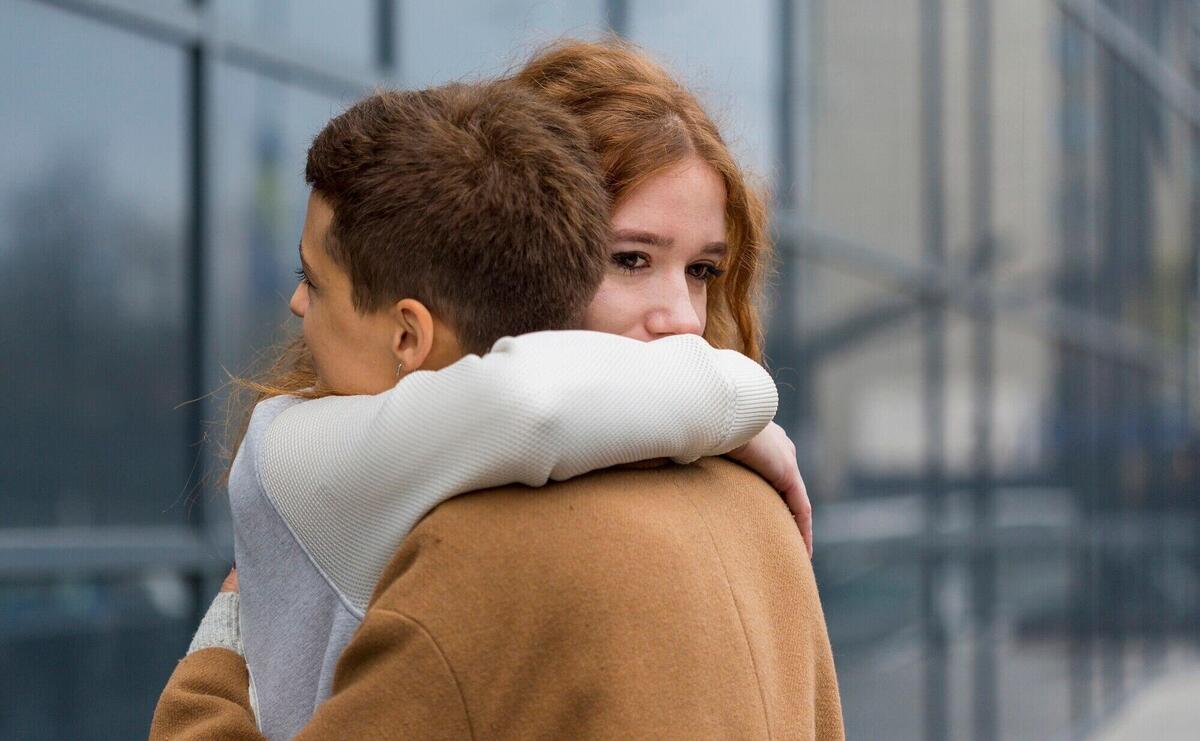 Close-up young women hugging each other