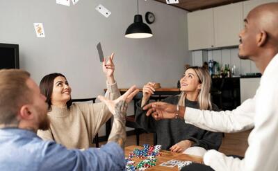 Friends having fun while playing poker