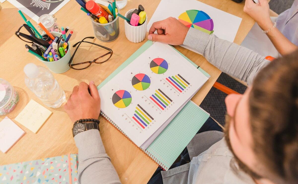 Crop people with papers at table