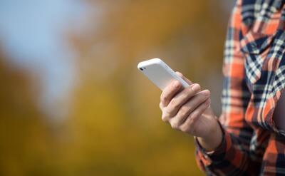 Female hand holding a mobile phone