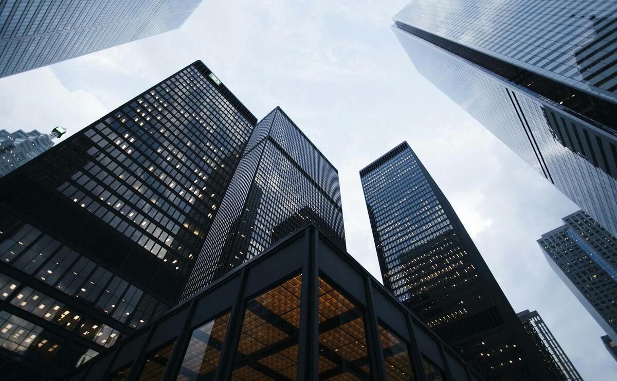 low angle photo of city high rise buildings during daytime