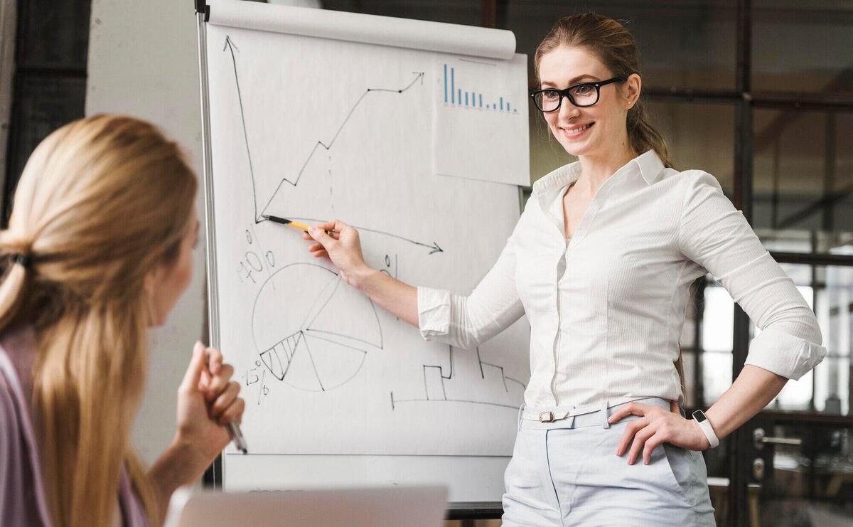 Businesswoman with glasses during a meeting presentation with her teammates