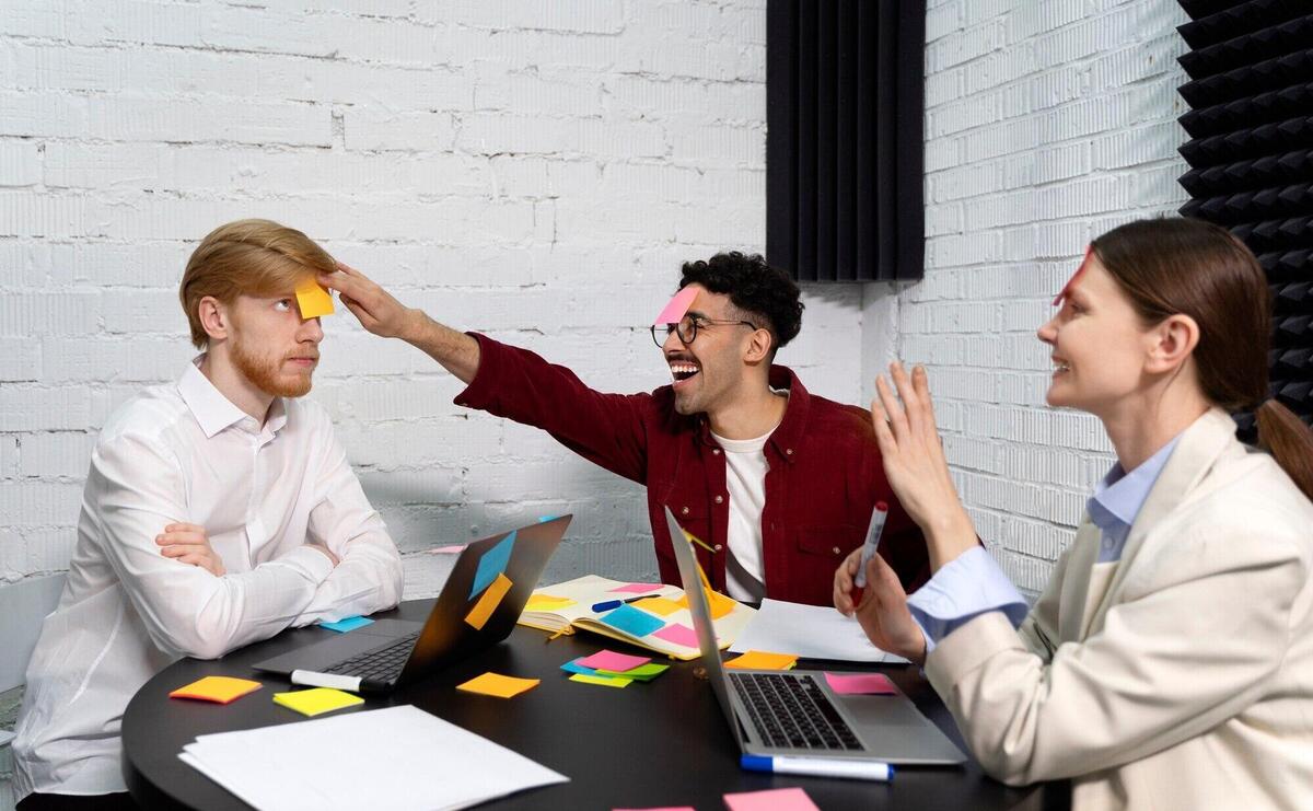 Medium shot smiley colleagues sticking post its