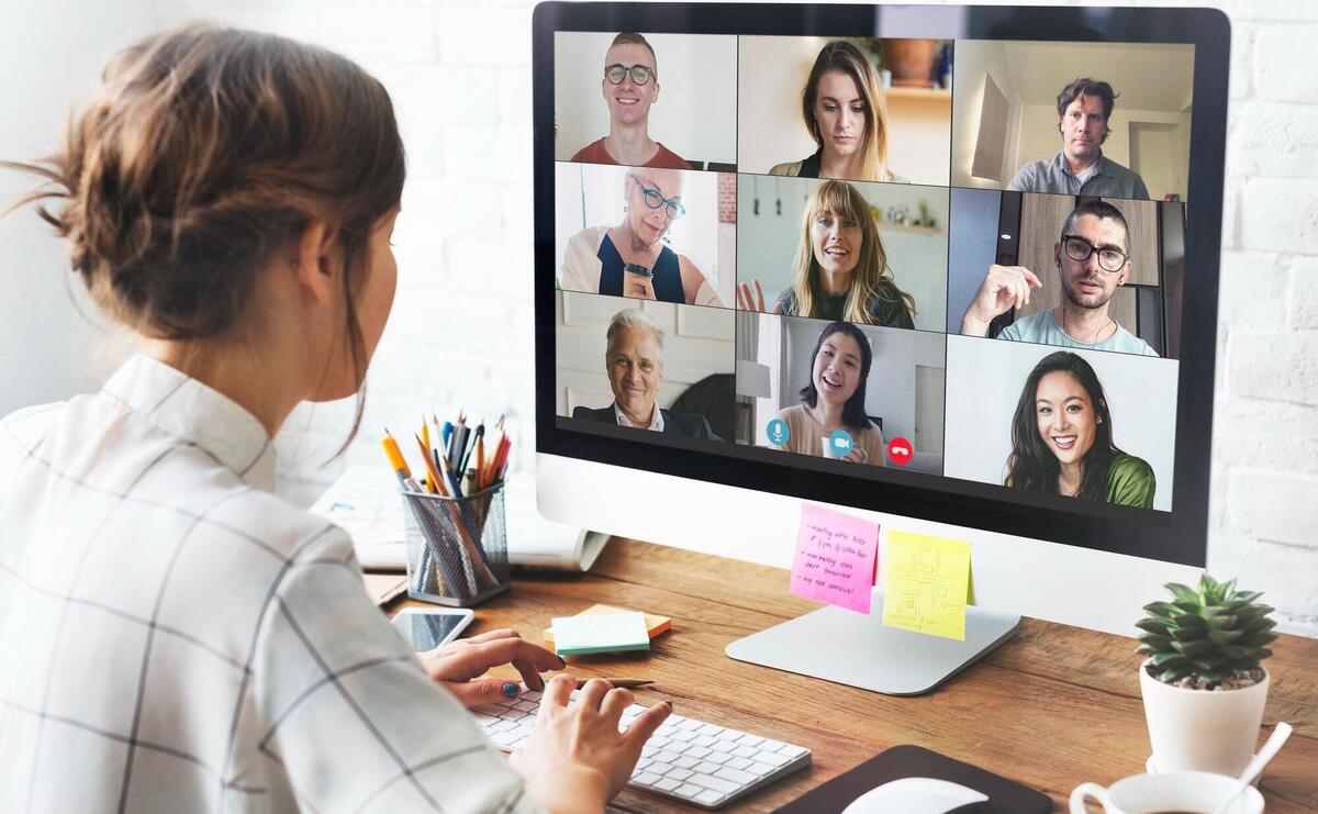 Woman in a video conference call in her home office.