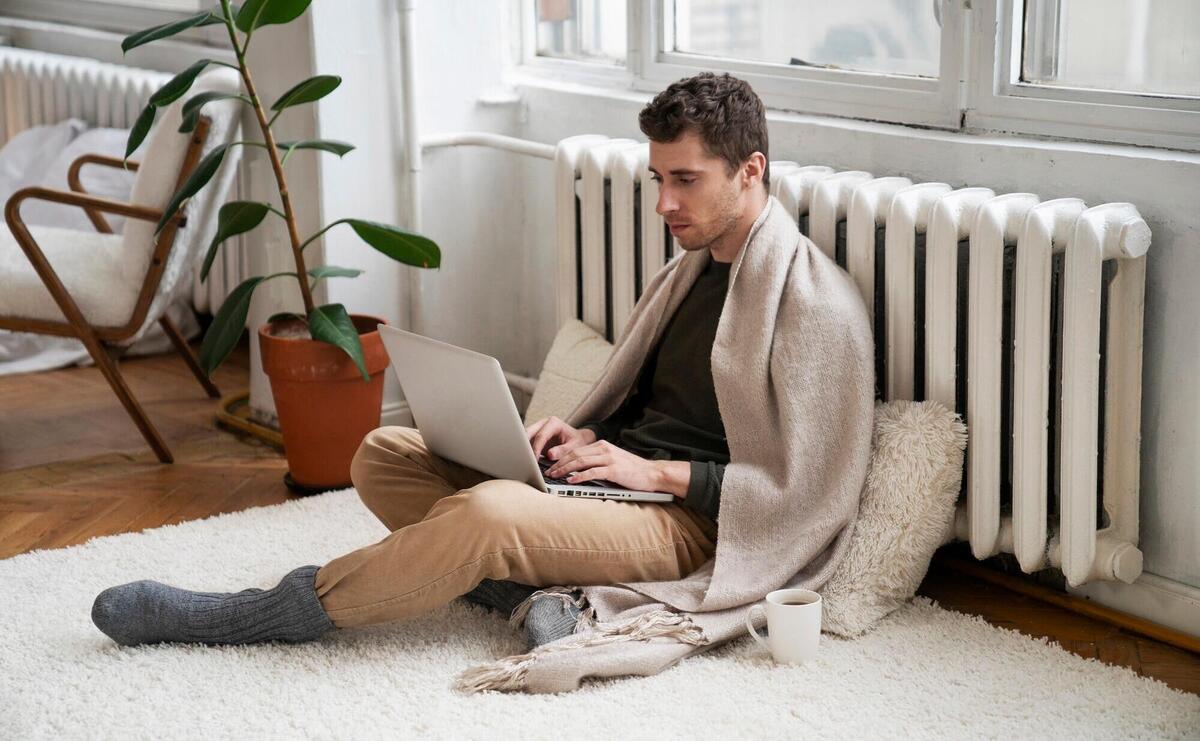 Close up on person near heater