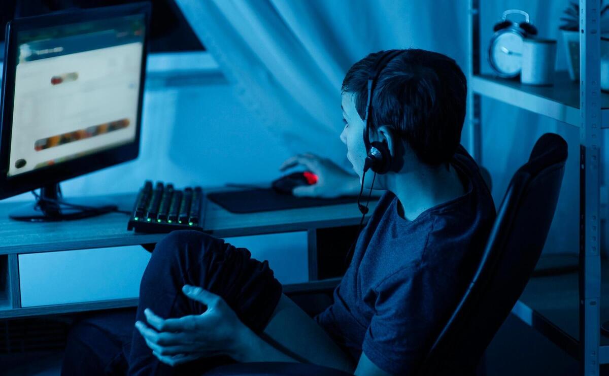 Young boy playing on computer