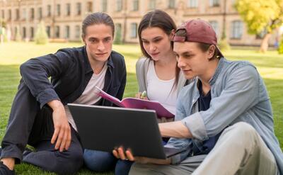 Group of teenagers discussing university project