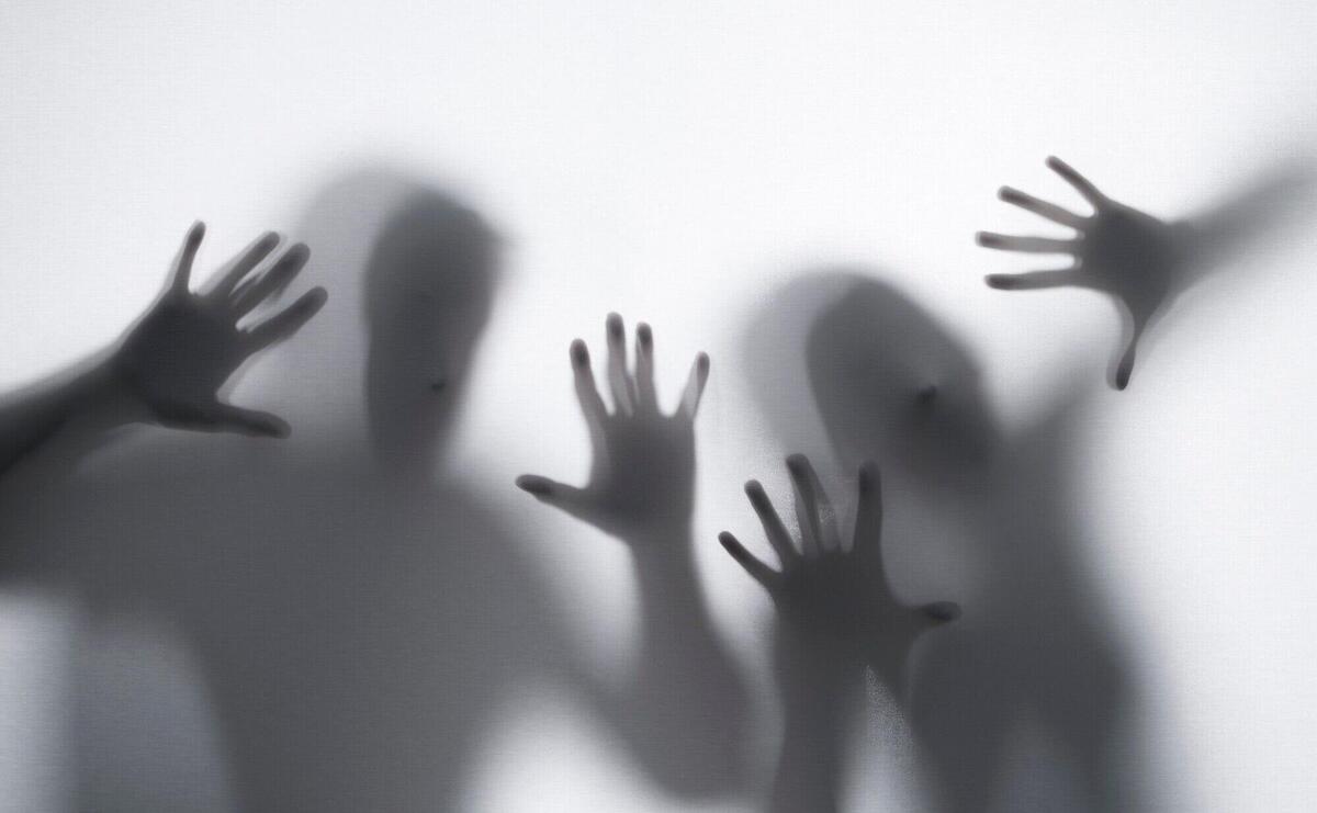 Terrifying hands silhouettes in studio