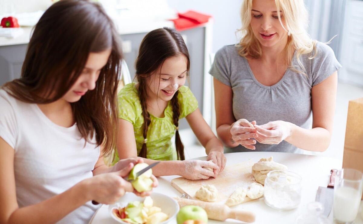 Happy girl cooking with flour