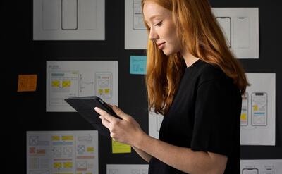 Female web designer in the office with notebook