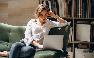 Young business woman working on a computer at home