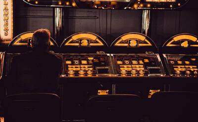 man playing arcade machine