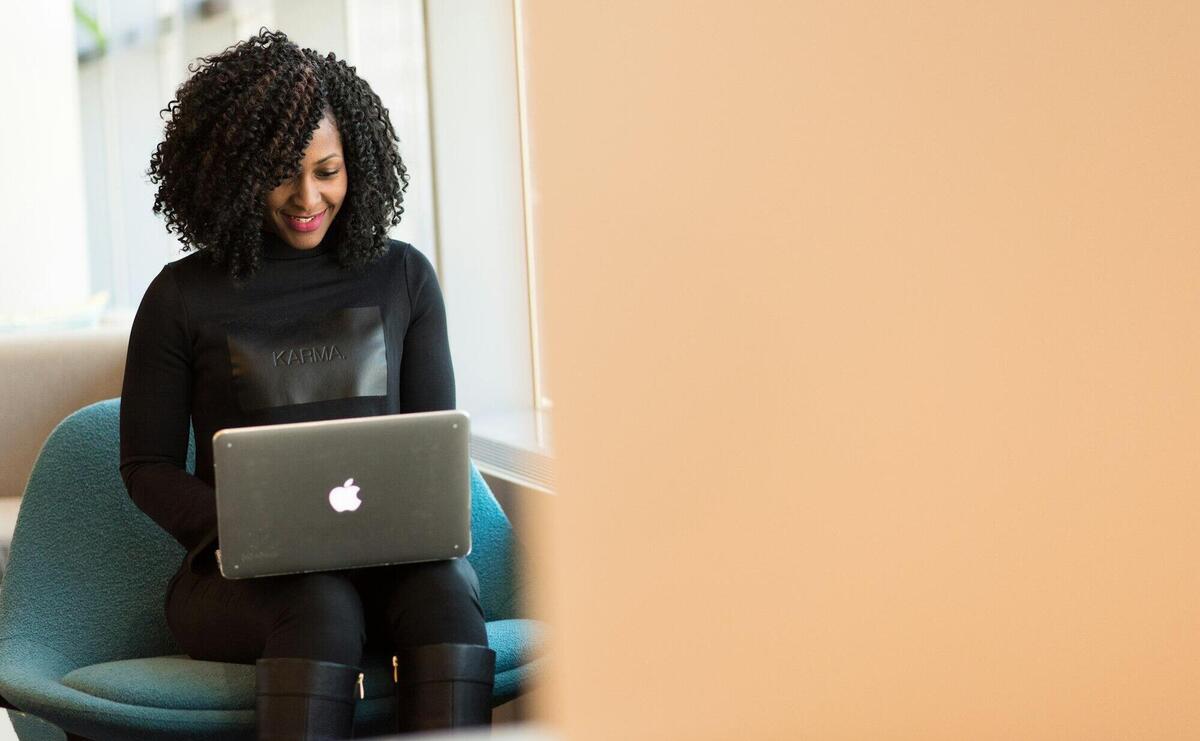 Woman Holding Macbook