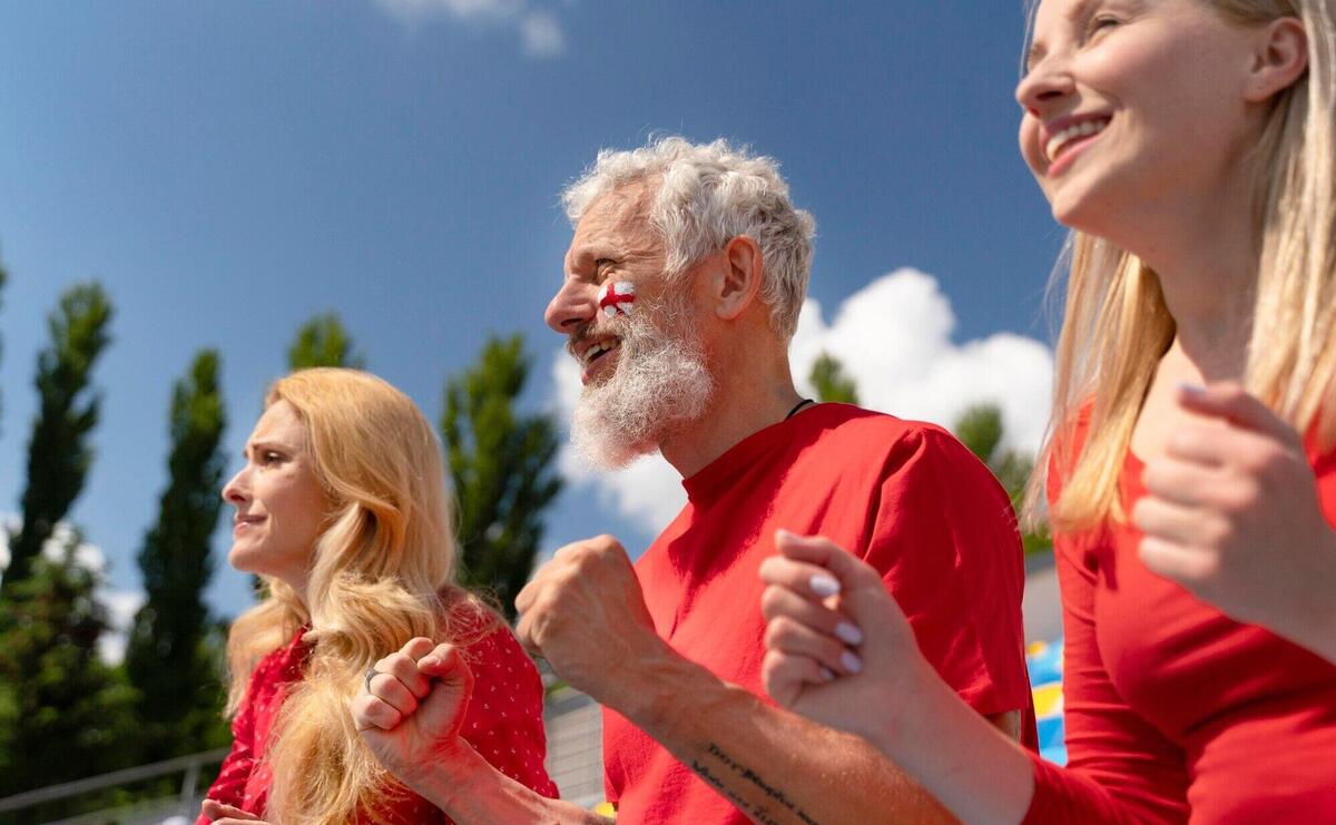 People looking together at a football game in a sunny day