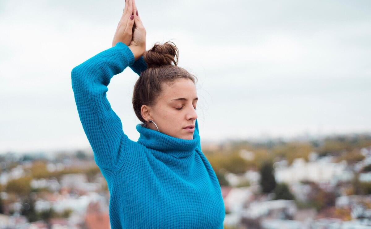 Relaxed girl practicing yoga outdoor