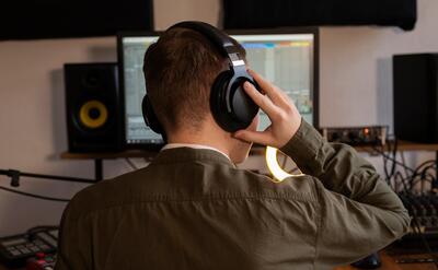 Medium shot musician working in studio