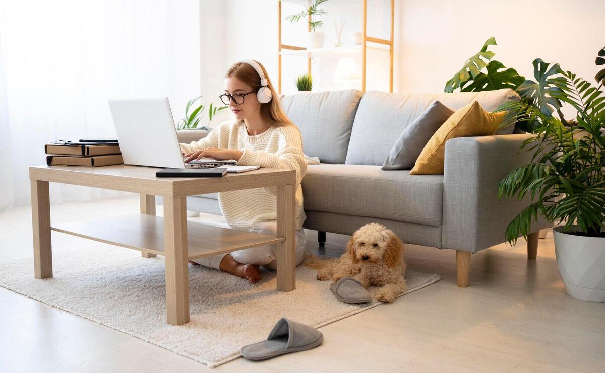 Full shot woman and dog at table