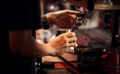 Close up Barista making cappuccino, bartender preparing coffee drink