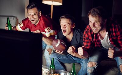 Excited men supporting their team