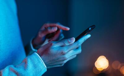 Side view of man using smartphone