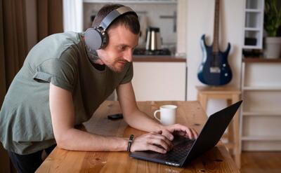 Man listening some music on headphone in his free time