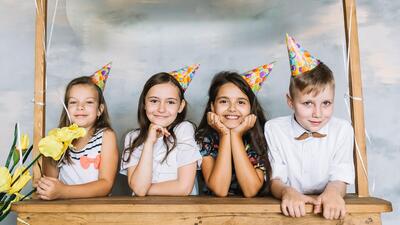 Kids behind stall on birthday party