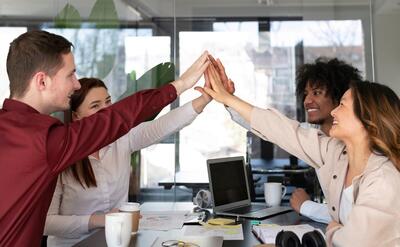 Office workers working together as a team