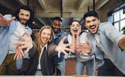 Happy overjoyed business team celebrate corporate victory