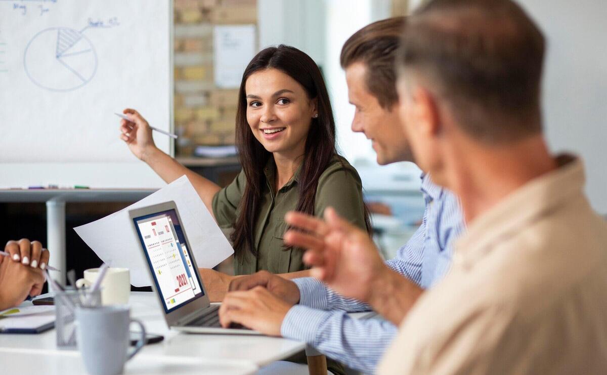 People smiling while in conference room