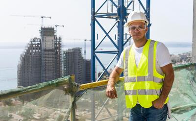 Outdoor construction worker standing at high altitude