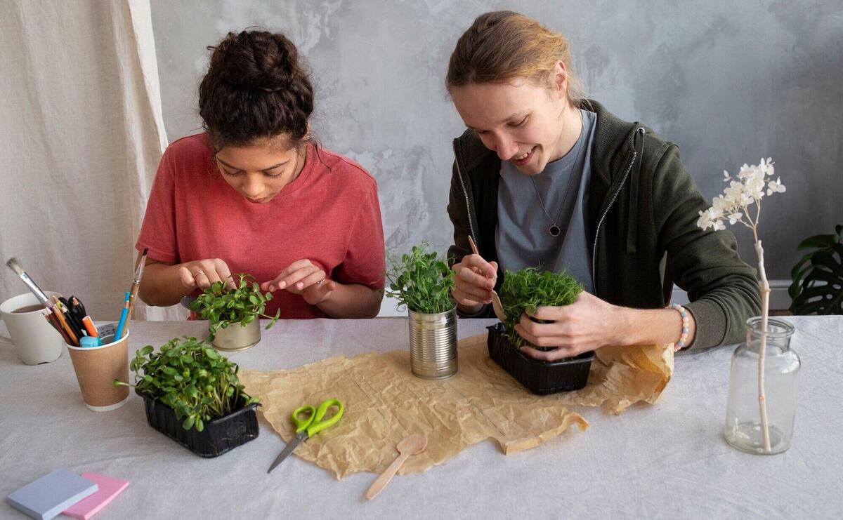 Young adult reusing cans for planting