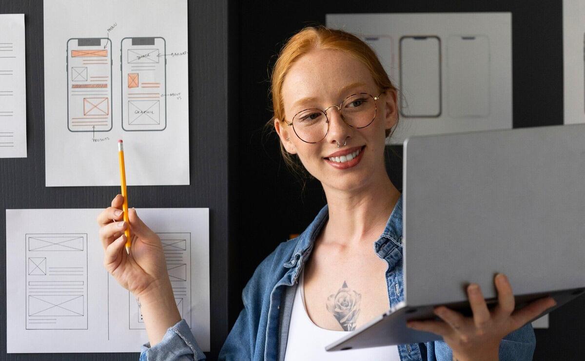 Female web designer in the office with laptop