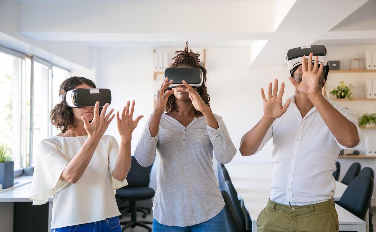 Excited team of three playing virtual game